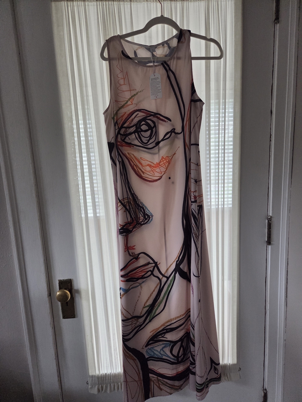 Amazon Sleeveless Maxi Dress in Blush Pink with Abstract Face Print